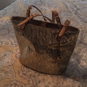 Classic golden Michael Kors bag.